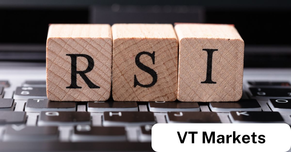 Wooden blocks spelling 'RSI' placed on a keyboard, symbolizing RSI divergence and its importance in technical analysis for trading with VT Markets.
